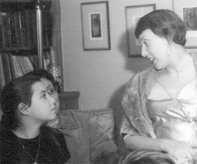 Judy looking up to Miranda, at a party in the Krasnow home, 1954
